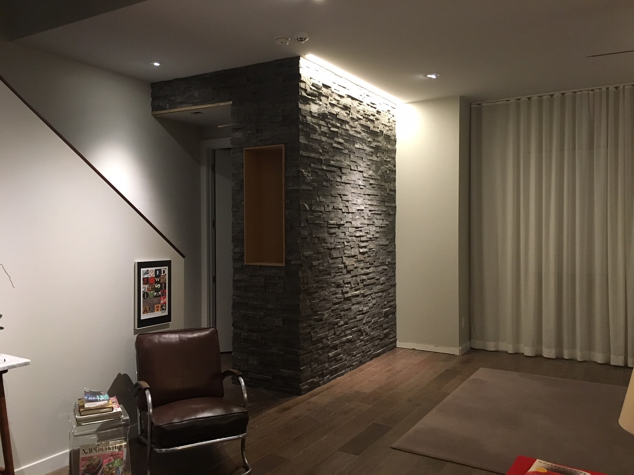 Stacked Stone Entryway Feature Wall project using Norstone Charcoal Standard Series Rock Panels